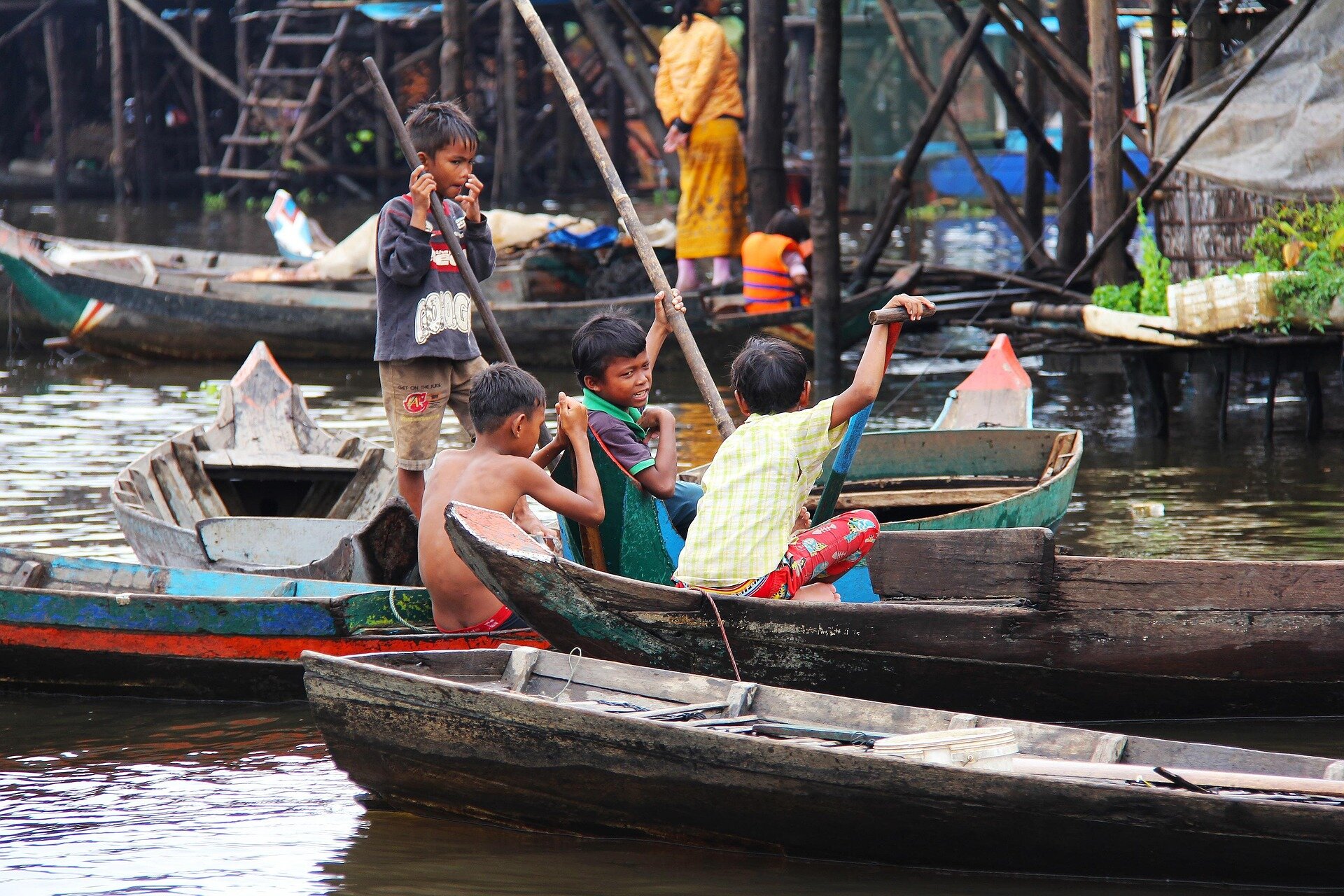 Tonle Sap Lake Children playing on the Boat, Siem Reap, Cambodia
